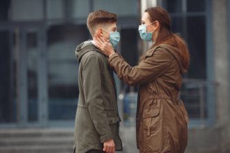A Boy And Mother Are Wearing Protective Masks