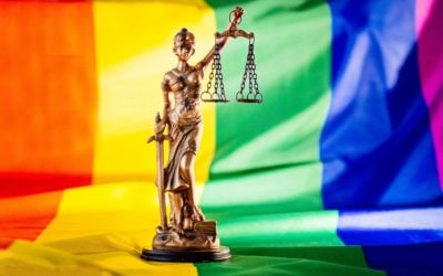 Statue of justice symbol of law and justice with lgbt flag